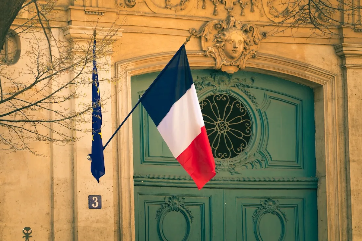 French flag hanging outside an official building